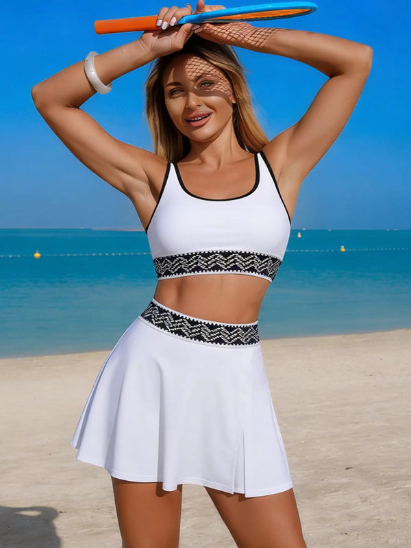 White contrast-trim tank and flared swim skort shown from the front