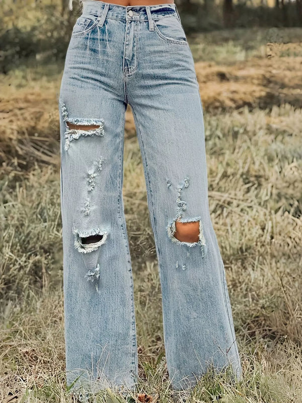 Light blue high-waisted wide-leg jeans with ripped knees and distressed thigh detail, front view outdoors