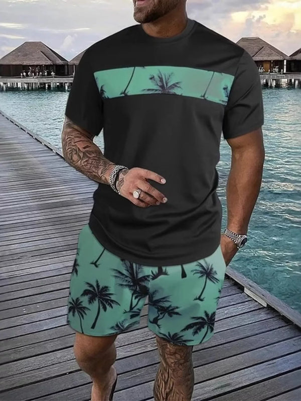 Black short-sleeve tee and shorts set with mint green panels and palm-tree print.