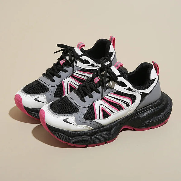 Pair of black, white and pink lace-up platform sneakers