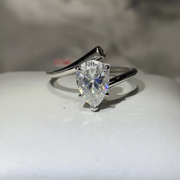 2 carat moissanite ring in sterling silver displayed on a light surface