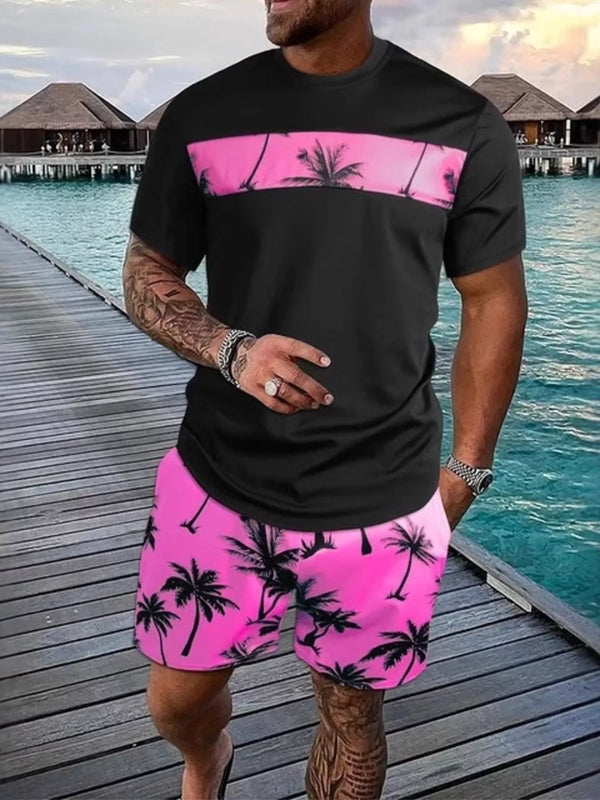 Black short-sleeve tee and shorts set with bright pink panels and palm-tree print.