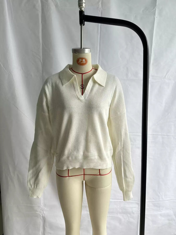 Cream ribbed polo sweater displayed on a mannequin, front view