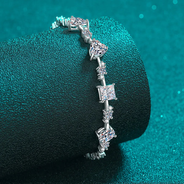 Close-up of square and round stones on silver bracelet