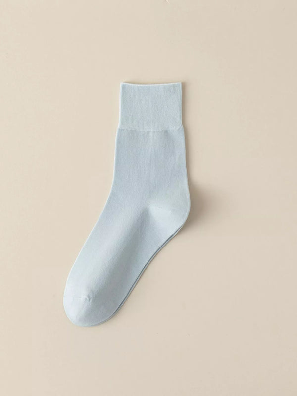 Light blue solid-color crew sock displayed flat