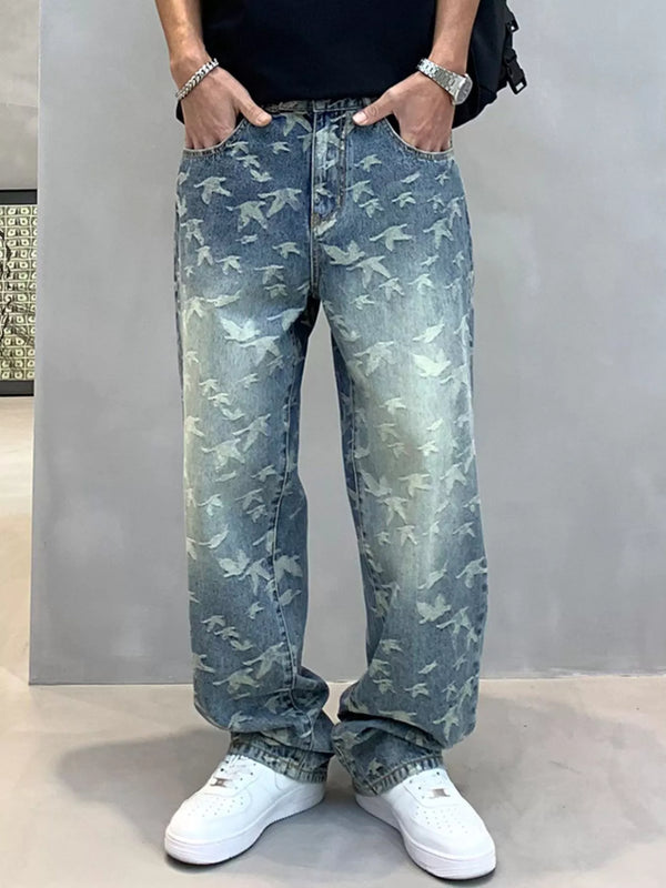 Front view of blue bird-print jeans with hands in the pockets