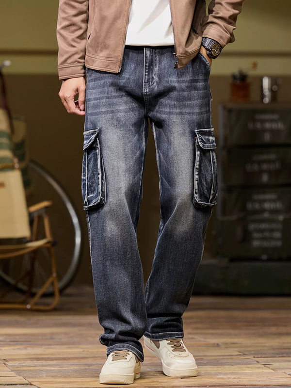 Dark washed cargo jeans shown from the front with flap side pockets