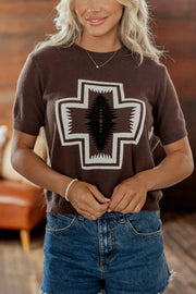 Front view of brown graphic top with jeans