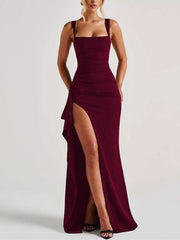 Front view of the burgundy sleeveless maxi dress with a high slit.