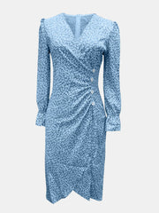 Front view of blue printed dress showing surplice bodice and midi hem
