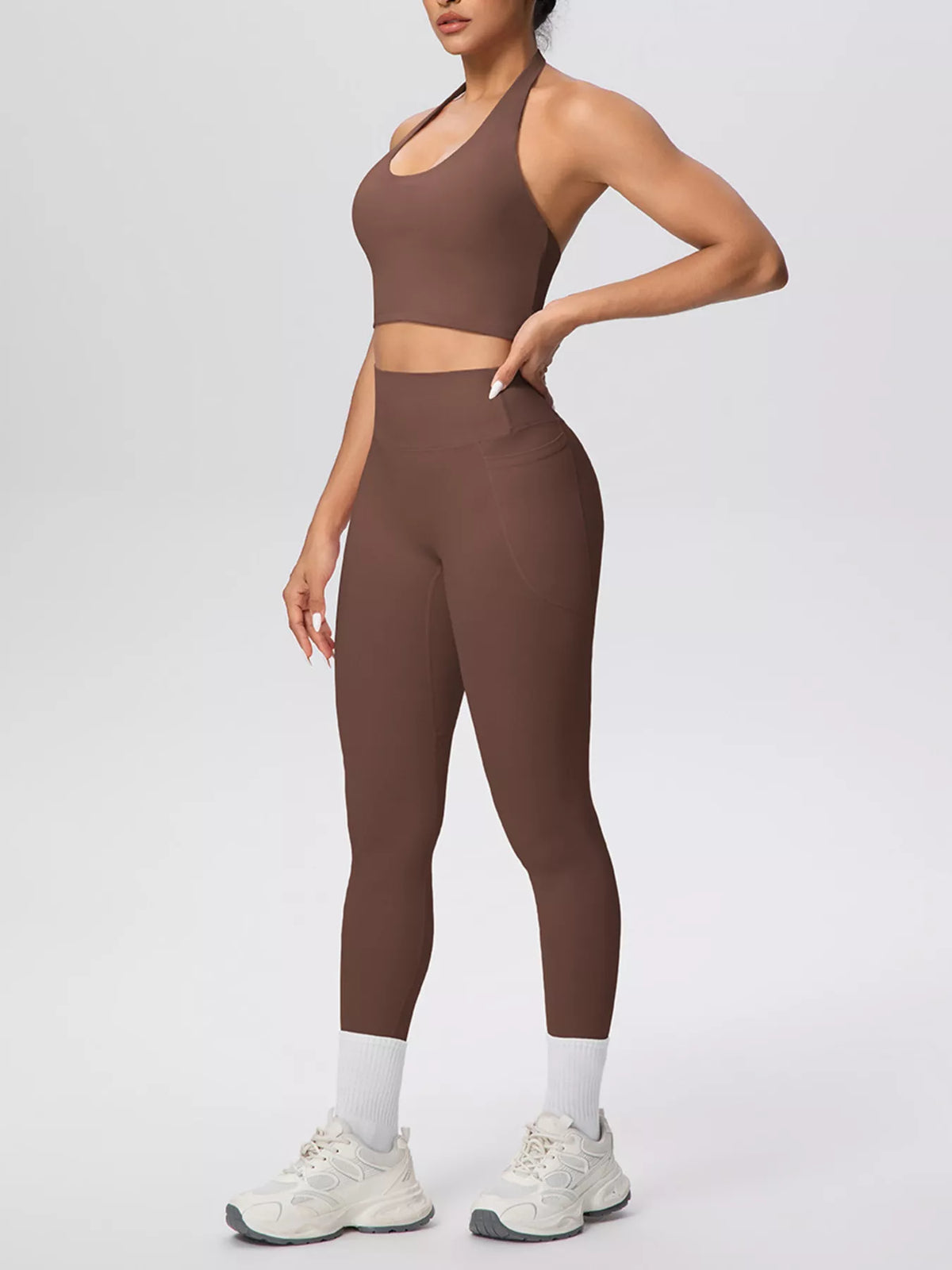Brown halter crop top and leggings shown from the front at an angle