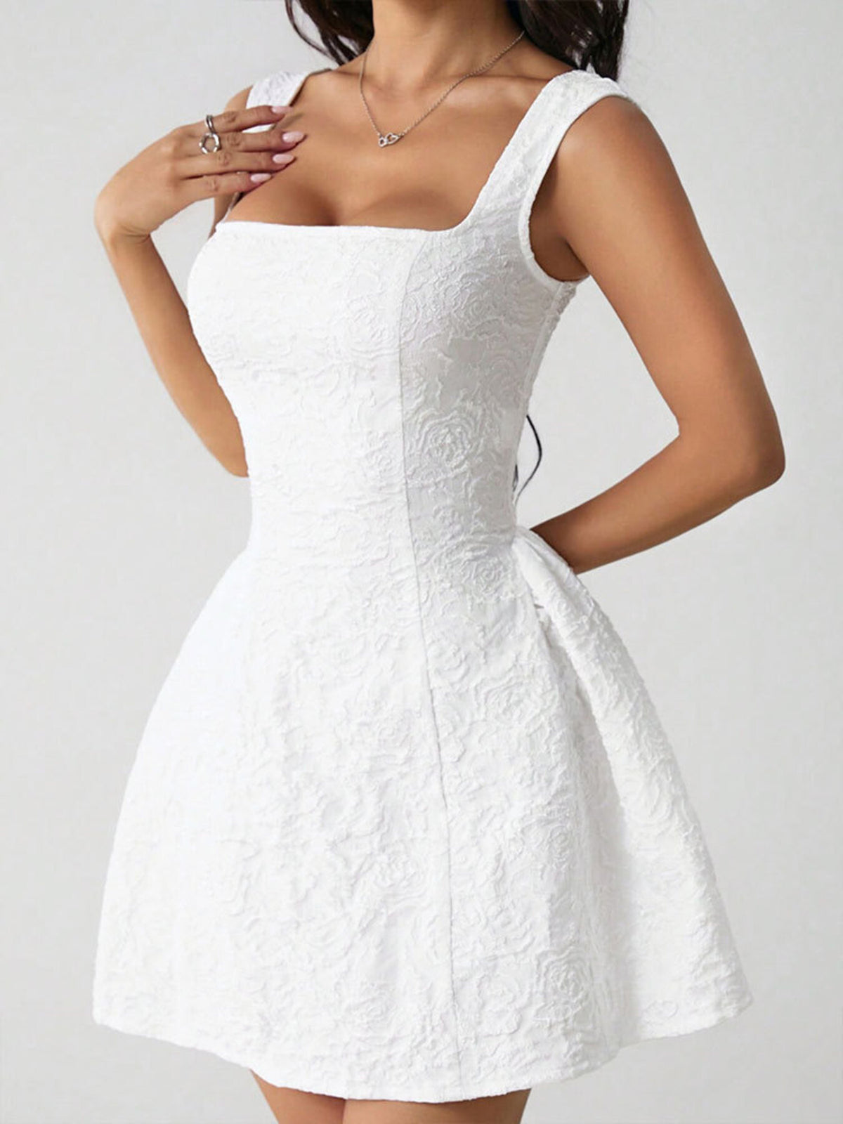 Front angled view showing square neckline and waist seams