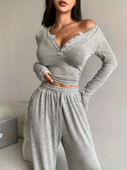 Close front view of light grey set showing off-shoulder button neckline and gathered waistband