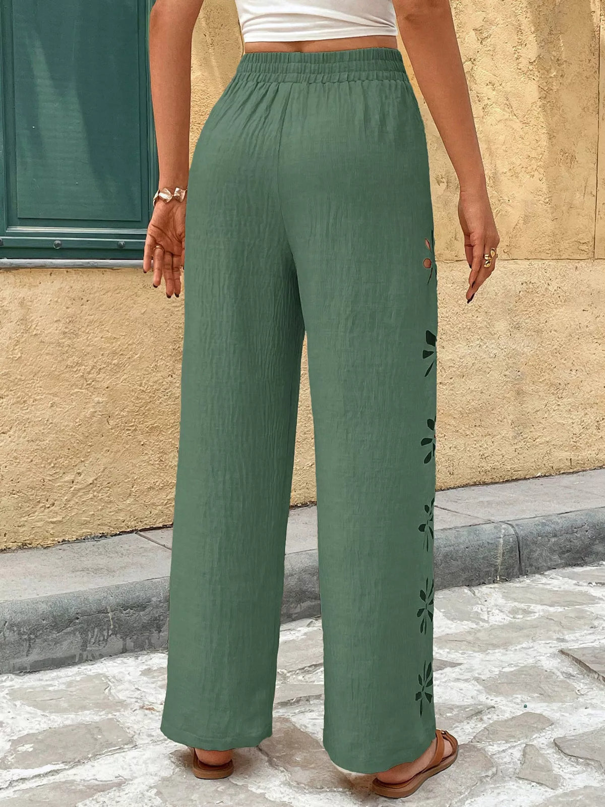 Back view of sage green wide-leg pants