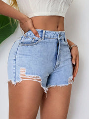 Angled side view of distressed denim shorts with ripped details and raw hems