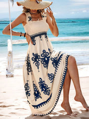 Close view of blue floral print and flowing maxi skirt