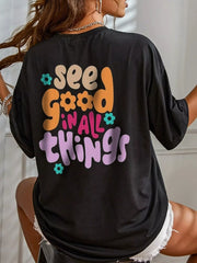 Back view of a black oversized T-shirt with a colorful See Good in All Things graphic