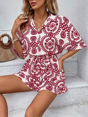 Women's printed tie-waist button-front romper, red-and-white print back view