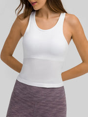Model wearing white ribbed racerback tank with heathered leggings