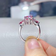 Rear view of the pink teardrop ring showing the raised stone setting and silver band