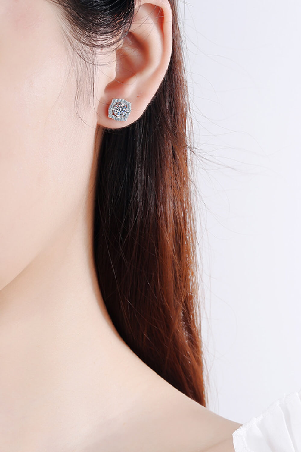 1 Carat Moissanite Geometric Stud Earrings — Geometric moissanite studs worn on an ear