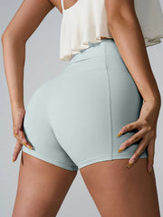 Rear view of pale blue fitted shorts with a wide high-rise waistband.