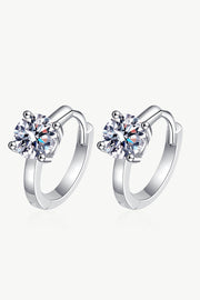 Pair of silver huggie earrings with round stones, front view
