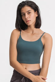 Model in a teal scoop-neck cami, shown from the front.