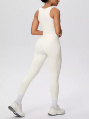 White tank and leggings shown from behind in a walking pose