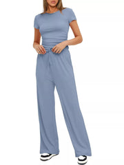 Three-quarter view of the light blue set showing the sleeveless top and relaxed pants.