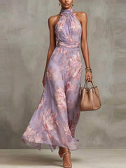 Model wearing a lavender floral sleeveless tiered maxi dress.