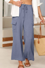 Blue cargo trousers shown at an angle with roomy legs
