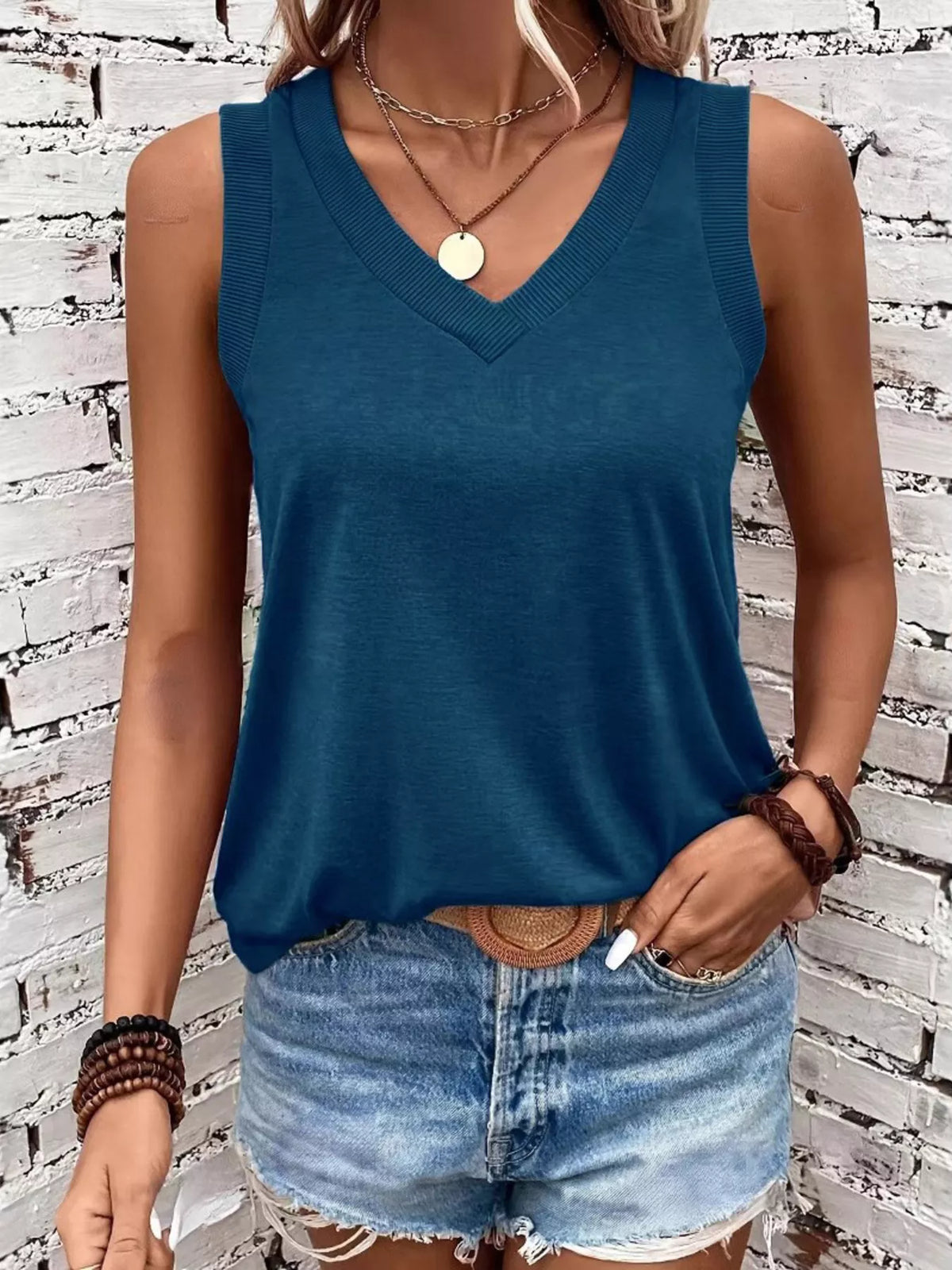 Blue V-neck tank top with ribbed neckline, front view