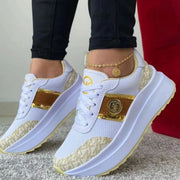 White and gold patterned platform sneakers, side view