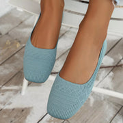 Sky blue mesh flats worn from the front
