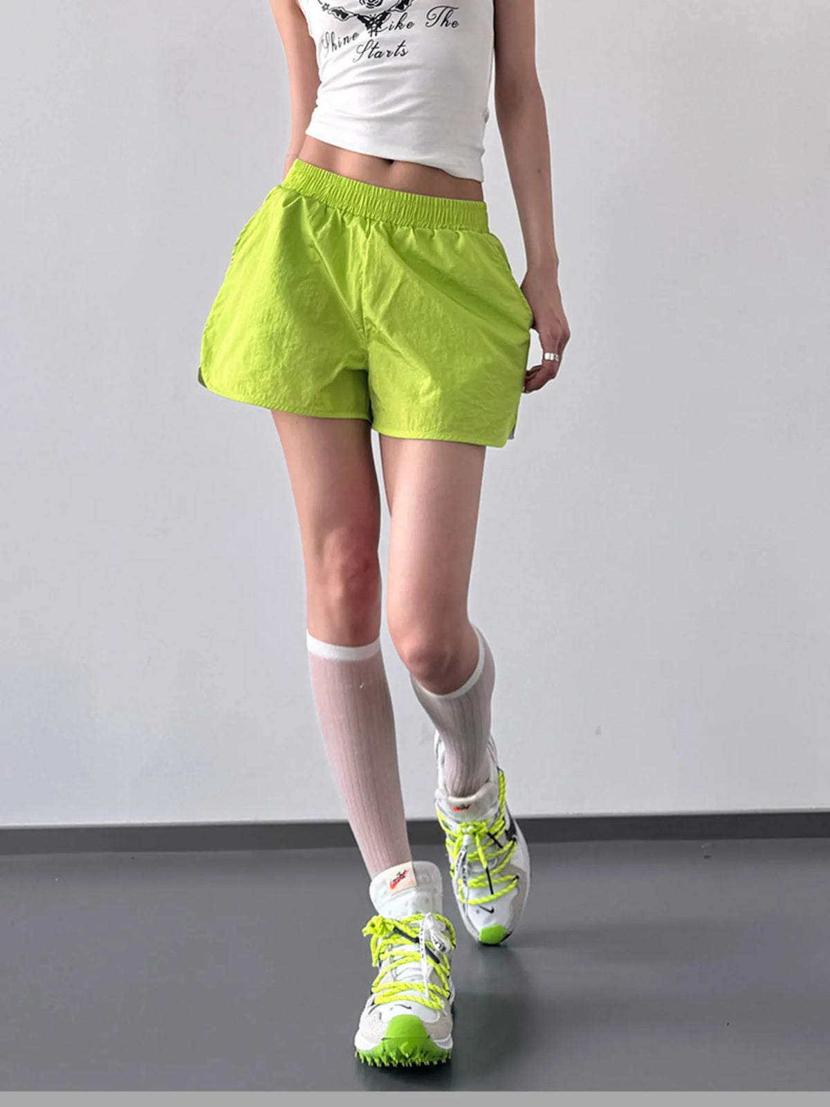 Full-length front view of elastic waist active shorts