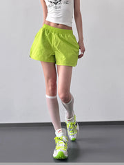 Full-length front view of elastic waist active shorts