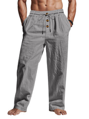 Black pants displayed flat showing elastic waist and wide-leg cut