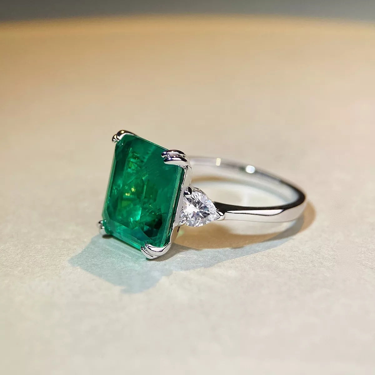 Angled view showing the raised setting of the green zircon ring.