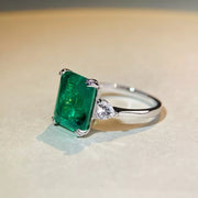Angled view showing the raised setting of the green zircon ring.