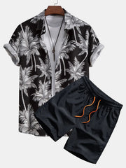 Black short-sleeve button-front shirt and shorts with white palm tree print