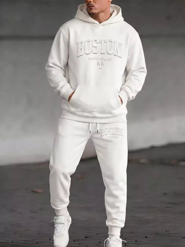 Model wearing white Boston hoodie and matching joggers