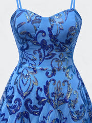 Close-up of the light blue dress's shaped bodice, waist seam and iridescent floral sequins.