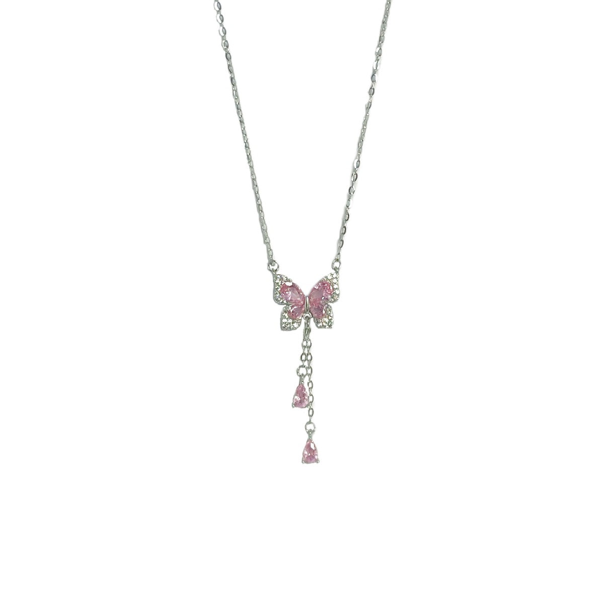 Silver butterfly pendant necklace with dangling stones shown on white