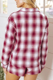 Back view of red plaid pajama shirt and matching shorts