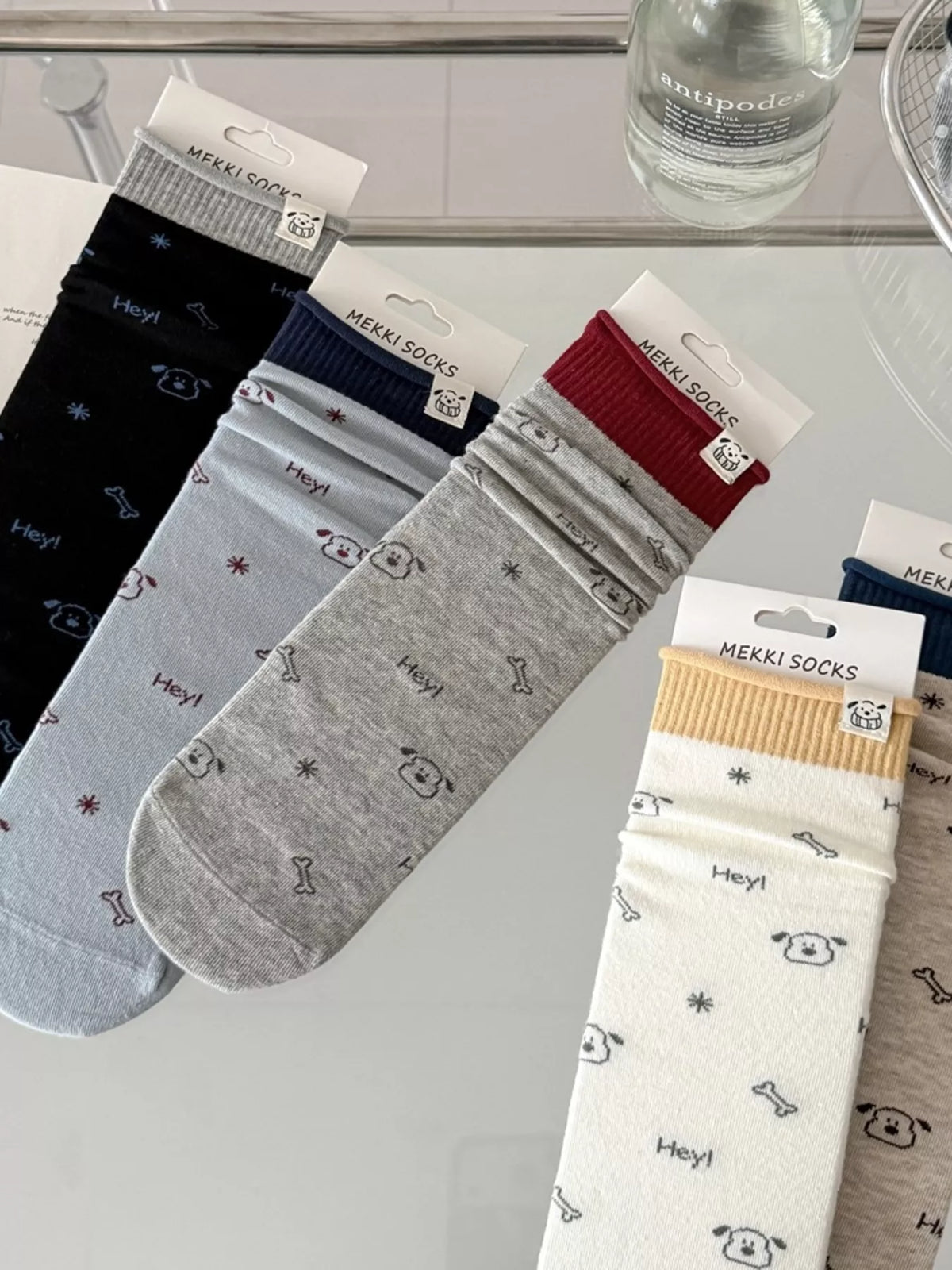 Blue, cream, gray and black printed socks displayed together
