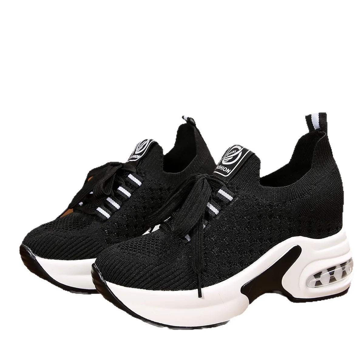 Pair of black lace-up mesh platform sneakers displayed on white background