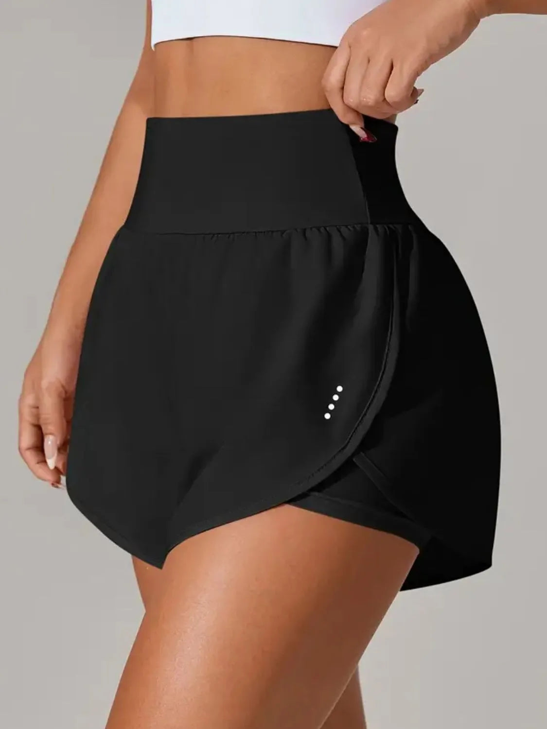 Black active shorts showing wide smooth waistband from the front