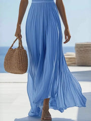 Full-length view of sky-blue pleated maxi dress with flowing skirt