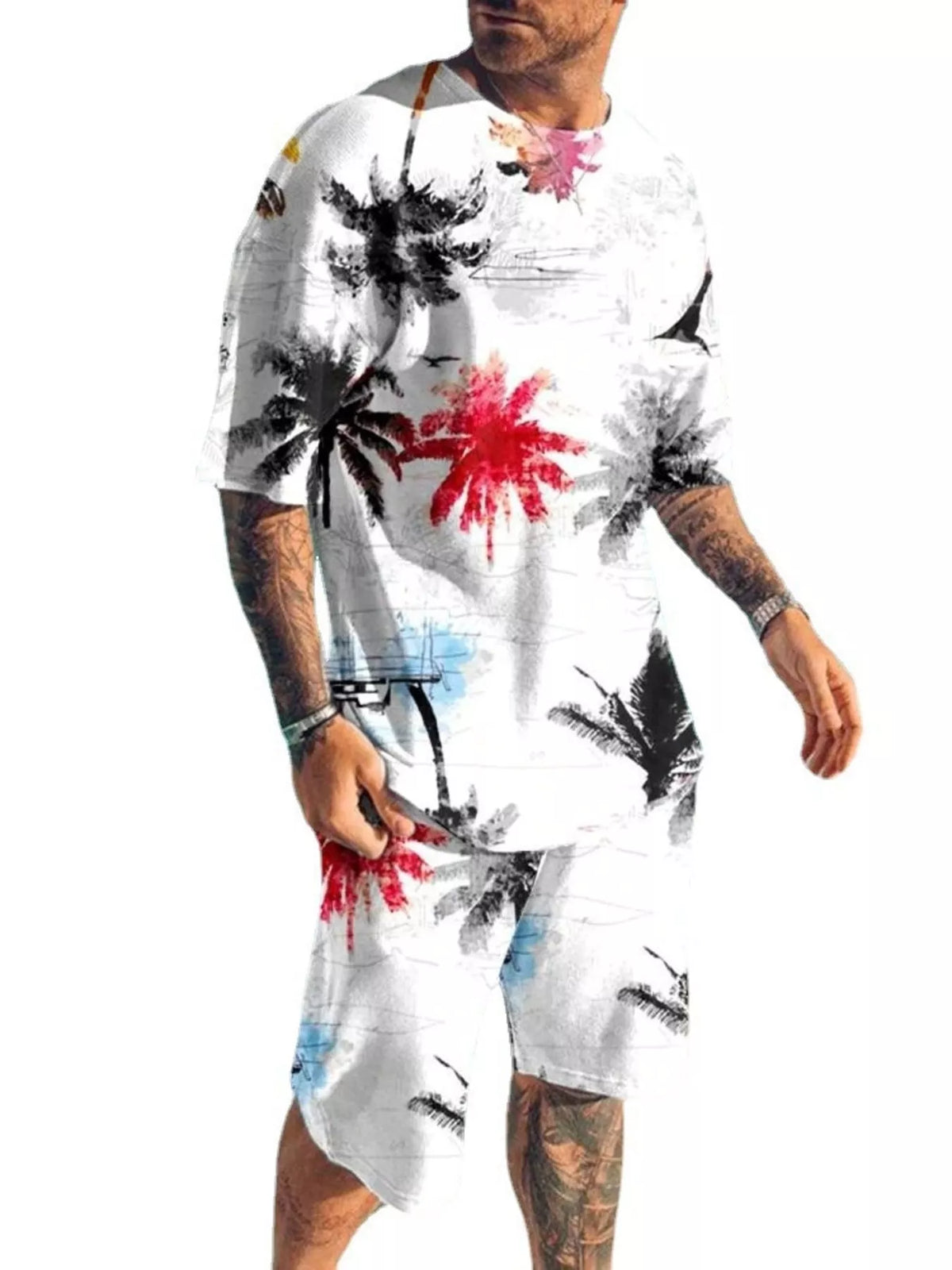 Model wearing white matching shirt and shorts with multicolor palm tree print